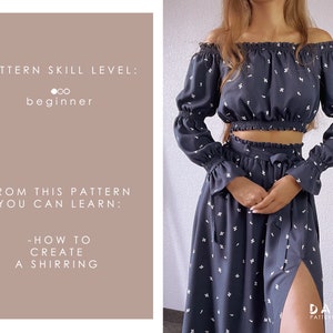 May include: A black off-the-shoulder top with white floral print and long sleeves. The top has a shirred elastic band at the waist. The model is also wearing a matching black skirt with a side slit and white floral print. The text "PATTERN SKILL LEVEL: beginner" and "FROM THIS PATTERN YOU CAN LEARN: -HOW TO CREATE A SHIRRING" is on the left side of the image. The text "DARIA PATTERNMAKING" is on the right side of the image.
