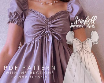 May include: A purple dress with a sweetheart neckline and puff sleeves. The dress has a gathered bodice and a tie at the waist. The dress is called "Seashell Summer Dress" and is a PDF pattern with instructions and a video tutorial.