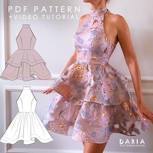 May include: A sleeveless high-neck dress with a tiered skirt, featuring a light pink fabric with metallic gold and blue floral patterns. The image includes the text PDF PATTERN + VIDEO TUTORIAL and DARIA PATTERNMAKING with two line drawings.