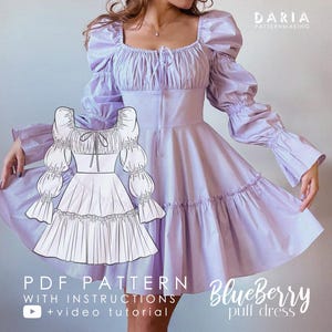 Può includere: Un cartamodello PDF per un abito a palloncino lilla con scollo quadrato e maniche a sbuffo. Il cartamodello include istruzioni e un tutorial video. Il testo sull'immagine recita "Blueberry puff dress".