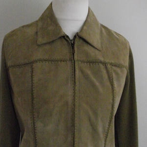 May include: A brown suede jacket with a zipper closure and ribbed knit sleeves.
