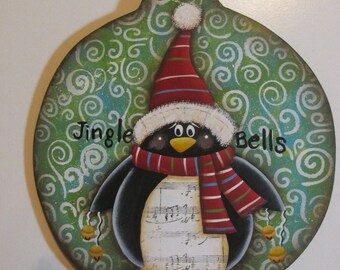 Penguin round wooden ornament.