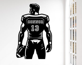 May include: Black and white silhouette of a football player holding a football. The player is wearing a jersey with the name "CONNOR" and the number "13" on the back.