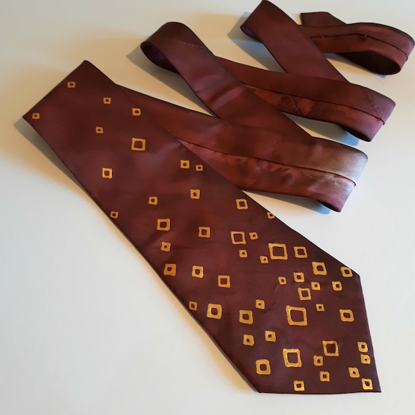 burgundy shirt with gold tie