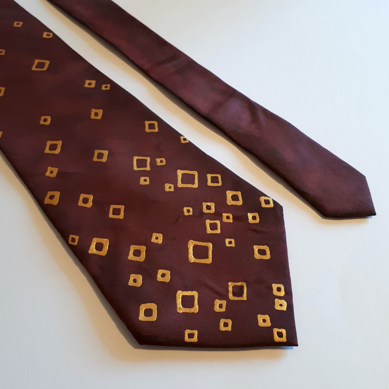 burgundy and gold necktie