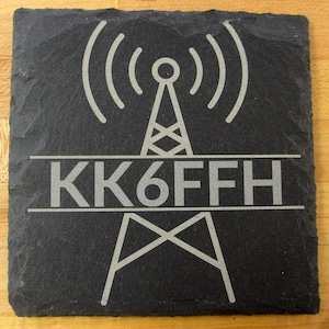 May include: Black slate coaster with a white engraved radio tower and the call sign "KK6FFH".