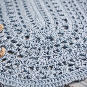 Light blue crochet beach bag with delicate openwork, photographed with ocean-themed props – ItWasYarn design
