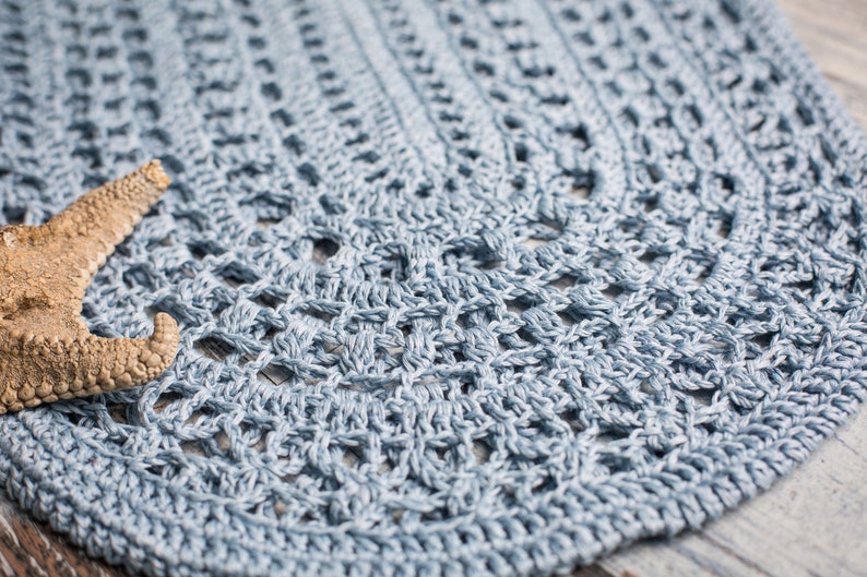 Light blue crochet beach bag with delicate openwork, photographed with ocean-themed props – ItWasYarn design