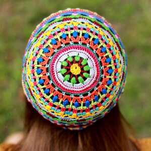 Photo from the back of the head displaying the unique crochet pattern of a hat by an indie designer from Ukraine.