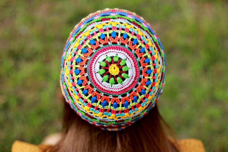 Photo from the back of the head displaying the unique crochet pattern of a hat by an indie designer from Ukraine.