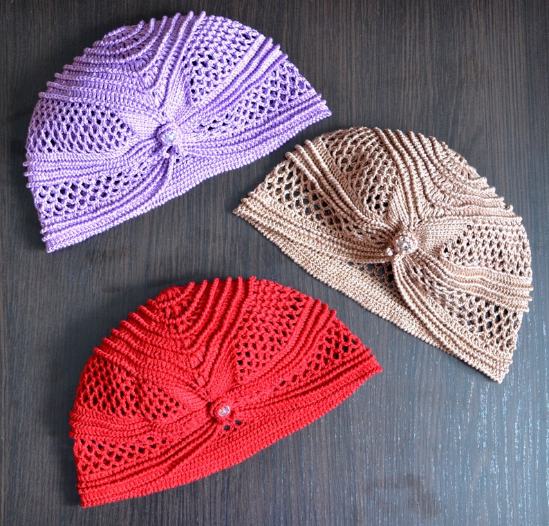 three crochet lacy hat wor woman with butterfly accent pattern
