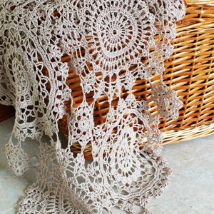 Close-up of lace crochet stitches in beige linen yarn, part of the Rozette Wrap pattern by Ukrainian designer Veselunka.
