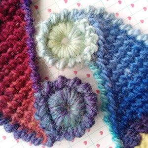 Close-up ofwool crochet paisley patches.