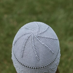 Close-up view from the back: crocheted women's hat with a simple stitch pattern.