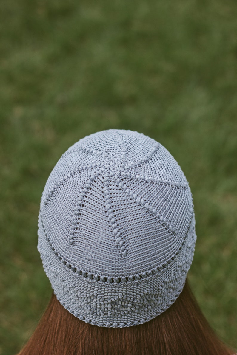 Close-up view from the back: crocheted women's hat with a simple stitch pattern.