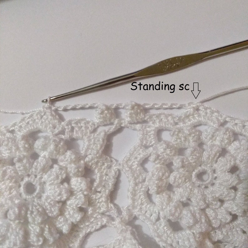 Crochet progress: white flower motifs