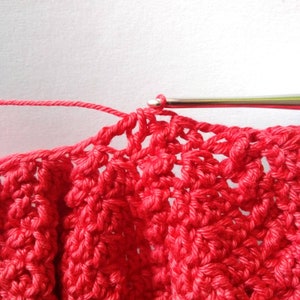 Crochet process with red  fine  yarn
