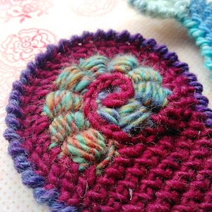Close-up crochet spiral of bullion crochet stithes.