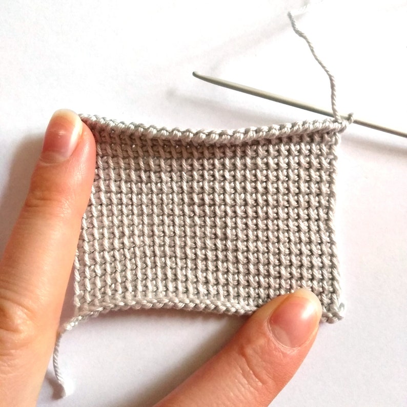 Basic Tunisian stitch (crochet), creating a light fabric.