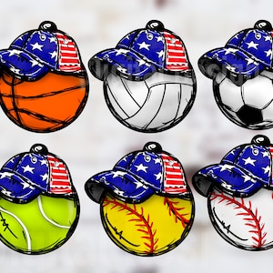 May include: Six different sports balls, each with a red, white, and blue baseball cap on top. The balls are a basketball, volleyball, soccer ball, tennis ball, softball, and baseball.