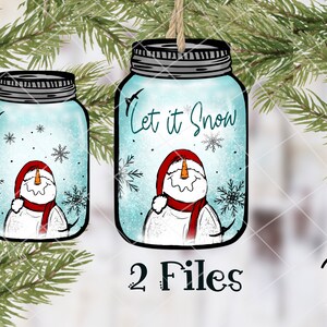 May include: Two digital files of a snowman inside a mason jar ornament. The jar is blue with white snowflakes and the text "Let it Snow".