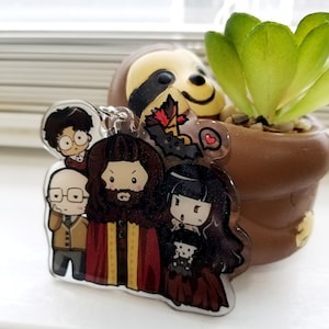 What we do in the Shadows 2.5in Glitter acrylic star keychain