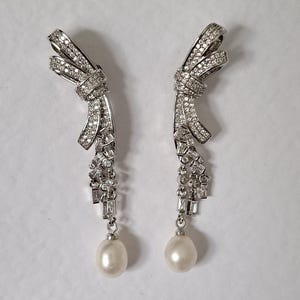 Freshwater pearl cubic zirconia long elaborate wedding earrings silver drop diamonds bow design designer handmade unique modern bride ribbon