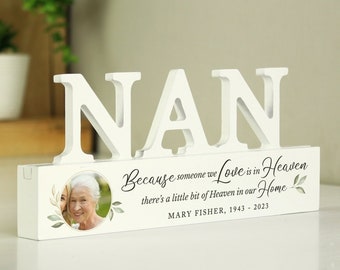 May include: White wooden sign with the word "NAN" in large letters. The sign has a photo frame with a picture of two women. The text below the photo reads "Because someone we Love is in Heaven there's a little bit of Heaven in our Home MARY FISHER, 1943 - 2023".