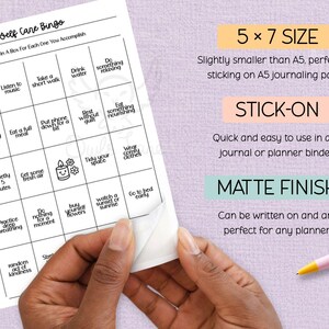May include: A white Self Care Bingo card with black text, featuring self-care activities. The card is 12.7 x 17.8 cm and stick-on with a matte finish. The image also shows text that says "Owls Lane".