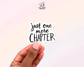 May include: White sticker with black text that reads "just one more chapter".