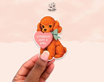 May include: A sticker of an orange cartoon poodle holding a pink heart-shaped sign with the words "LITERALLY JUST A GIRL." The poodle has a green bow. The sticker is set against a pale pink backdrop.