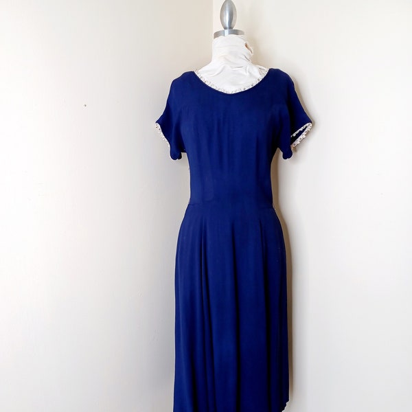 1950s size medium day dress with large rear back buttons pockets in rayon navy with rhinestones and lace trim // Size medium