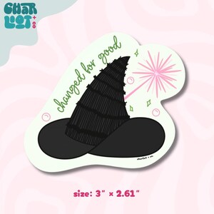 May include: A die-cut sticker featuring a black witch hat with the text "changed for good" in green script. A pink burst and small stars and circles accent the design. The sticker measures 3" x 2.61".