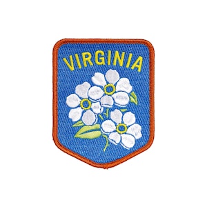 May include: A blue and orange embroidered patch with the word "VIRGINIA" in yellow lettering and three white flowers with yellow centers.