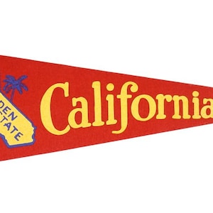 May include: Red felt pennant with yellow text that reads "California" and a yellow outline of the state of California with the text "the GOLDEN STATE" inside.
