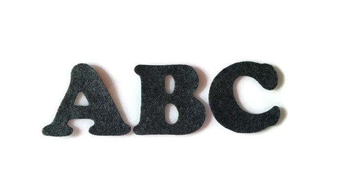 12 Packs: 42 ct. (504 total) 1.5 Iron-On Black Glitter Cooper Letters by  Imagin8™