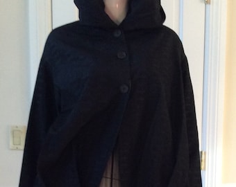 Romeo Gig,I vintage 1990 cocoon coat in black with a pleated balloon hem, lined, long sleeves, button closure