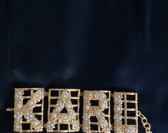 Karl Lagerfeld vintage 1986, autêntico não usado, bronze com acabamento em ouro fosco, articulado, cerca com flores, pérolas de traje cabochão