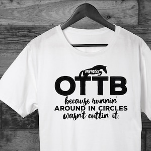 May include: White t-shirt with a black silhouette of a horse and the text "OTTB because runnin' around in circles wasn't cuttin' it."