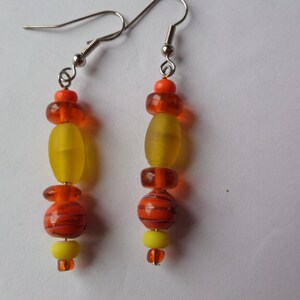 Bright yellow and bright orange beaded dangle earrings for pierced ears. One of a kind. Elegant, sexy,long. French wires. by Helen Rosenhaft