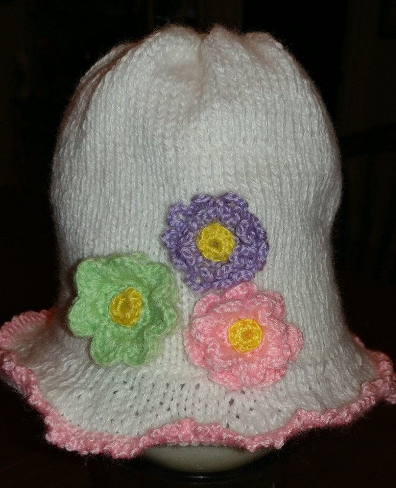 easy care White beanie Hand knit Infant Approx crocheted mutli-colored flowers Baby Girl Hat pink trim 6-12 month By Helen Rosenhaft