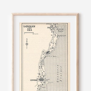 May include: A vintage black and white map of Lovran and Ika, Croatia. The map shows the coastline, roads, and landmarks of the area. The title of the map is "Lovran and Ika" and the scale is indicated as "200 yards".