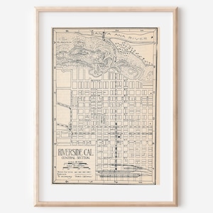 May include: Framed vintage map of Riverside, California, Central Section, in black and white. The map shows the city's layout, streets, and Santa Ana River. The map is in a light wood frame.