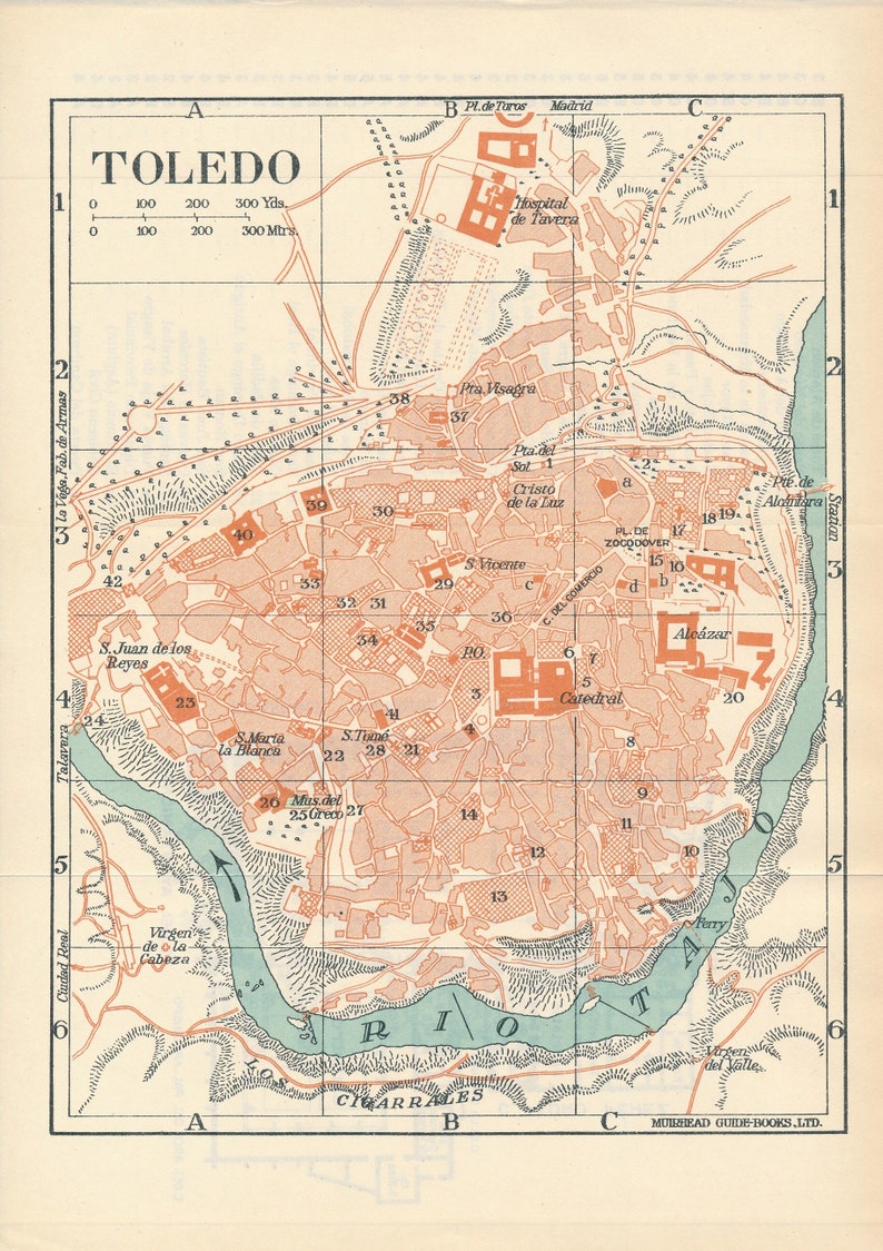 May include: A vintage map of Toledo, Spain, with a detailed layout of the city's streets and landmarks. The map is printed in shades of brown, green, and blue, with the Tagus River flowing through the center. The map includes labels for key locations, such as the Cathedral, Alcazar, and the Plaza de Zocodover.