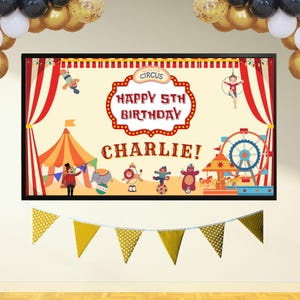 May include: A circus-themed birthday banner with the text "Happy 5th Birthday Charlie!" in a decorative frame. The banner features circus performers, a Ferris wheel, and a circus tent. Gold and black balloons are in the background.