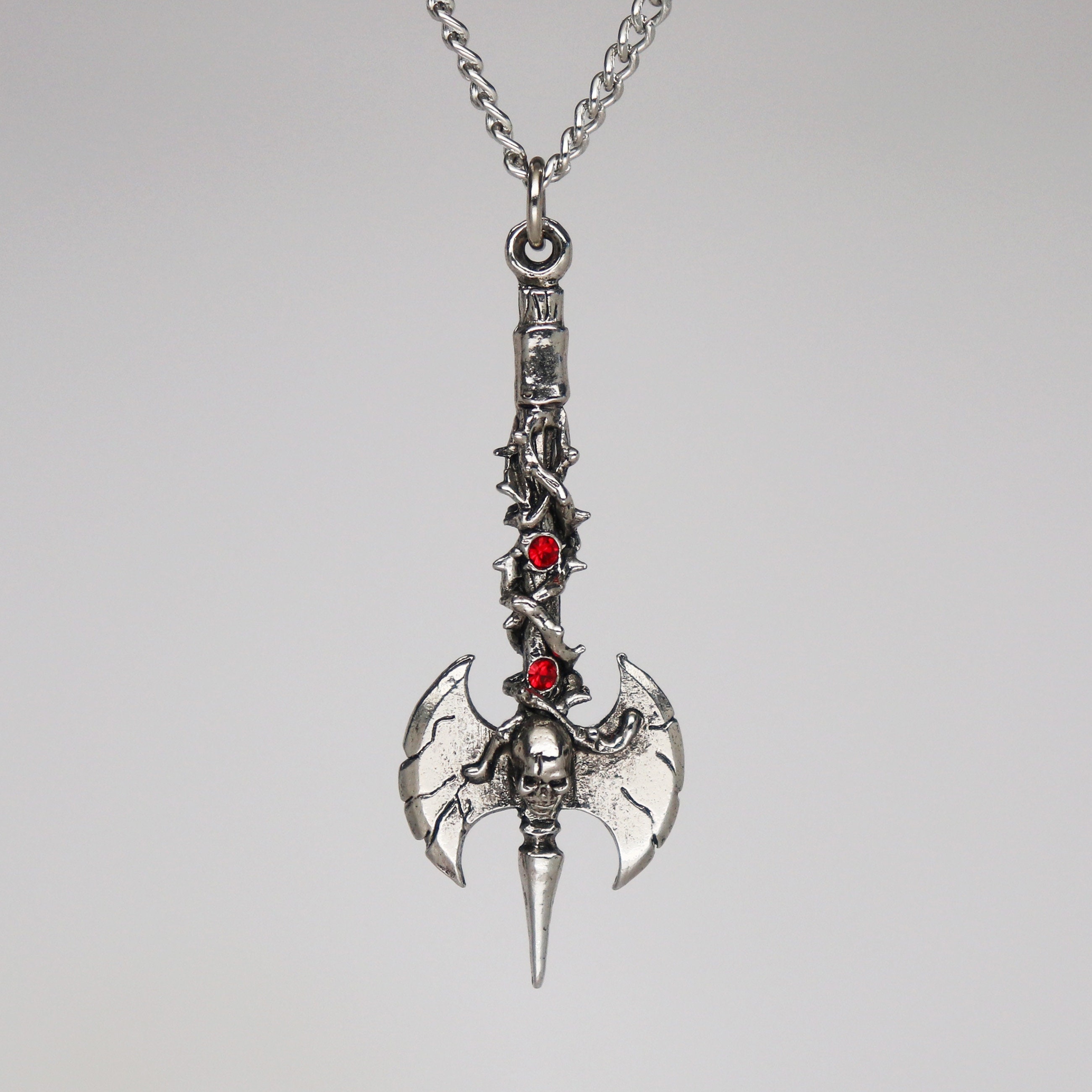 Double Axe in Vines With Skull and Red Crystals Pendant Necklace