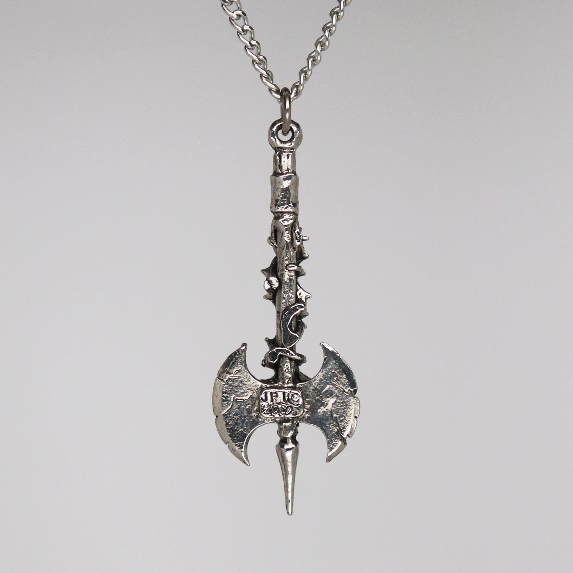 Double Axe in Vines With Skull and Red Crystals Pendant