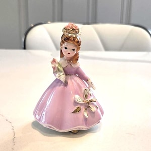 Josef Originals girl in pink w/ pink flower. Little Guest Series 4 half figurine