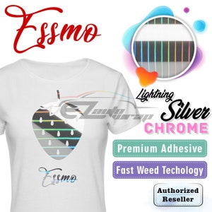 May include: White t-shirt with a silver chrome strawberry graphic. The text "Essmo" is printed on the shirt and above the graphic. The image also shows a close-up of the silver chrome material with a rainbow iridescent effect. The text "Lightning Silver Chrome" is printed in a pink font. The text "Premium Adhesive" is printed in a green font. The text "Fast Weed Technology" is printed in a purple font. The text "Authorized Reseller" is printed in a white font on a purple background.