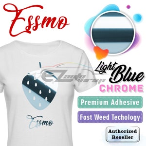 May include: A white t-shirt with a light blue chrome strawberry graphic and the word "Essmo" written in red and black. The text "Light Blue Chrome" is written in black and white. The text "Premium Adhesive" is written in green. The text "Fast Weed Technology" is written in purple. The text "Authorized Reseller" is written in white with a purple border.